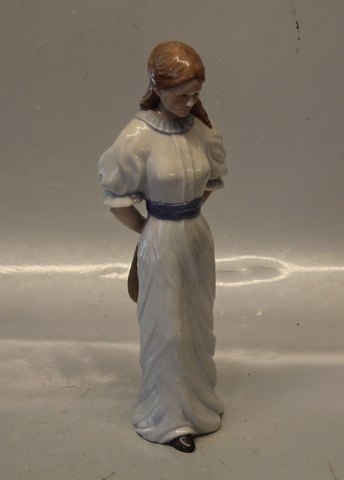 Royal Copenhagen figurine 050 RC Lady Walking with Hat Behind Her, 26 cm 
(1249050) Scandinavian women series, Allan Therkelsen