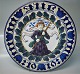 1919 Den kongelige porcelænsfabriks Store Juleplatter af Fajance fra Aluminia 
1163-1046 Julerelief 1919 Engel med flag R. Harboe 30 cm